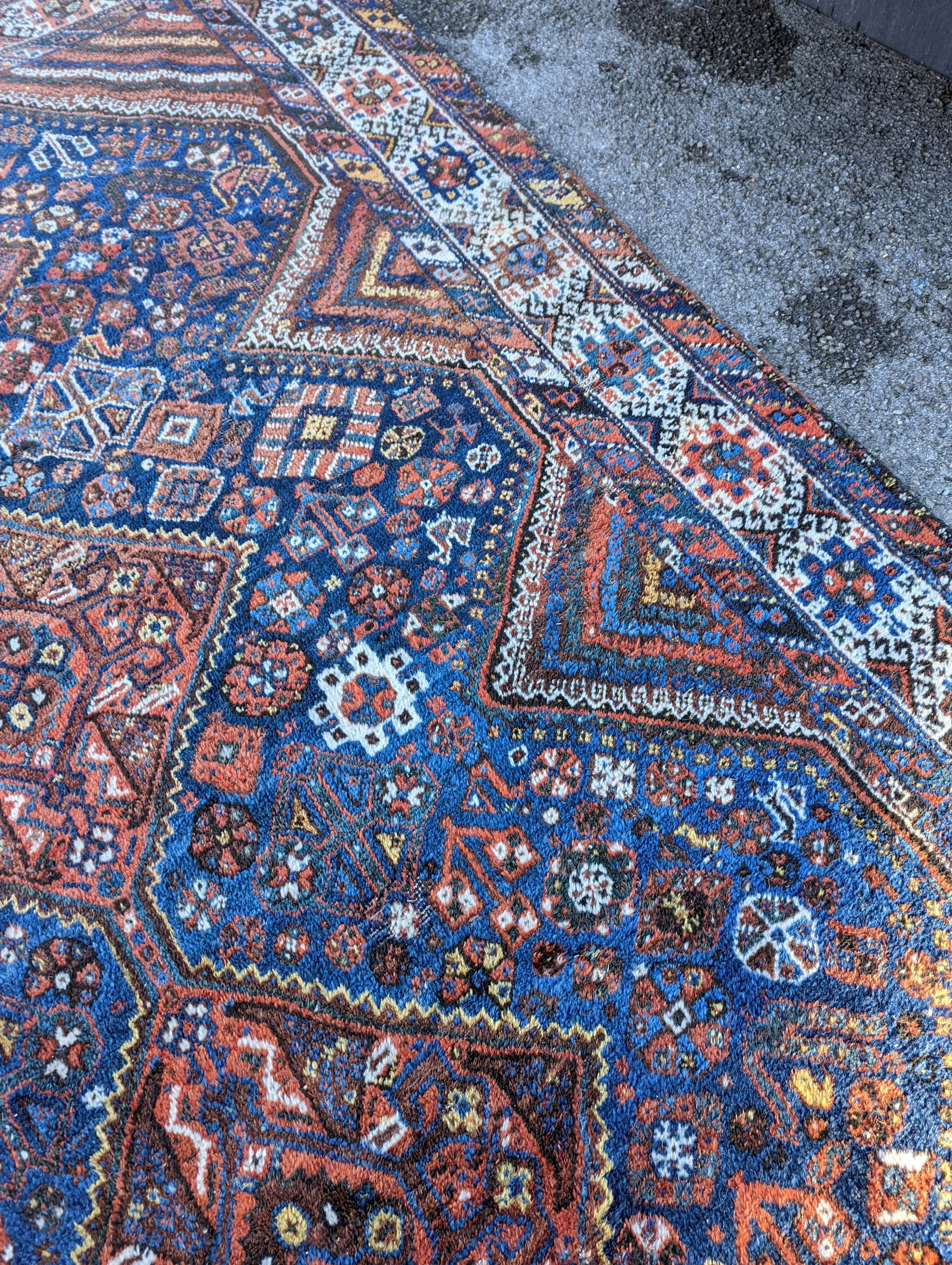 A Shirvan blue ground carpet, 315 x 222cm